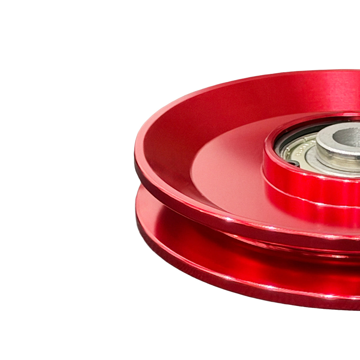 Red anodized aluminum cable pulley image three-quarter view